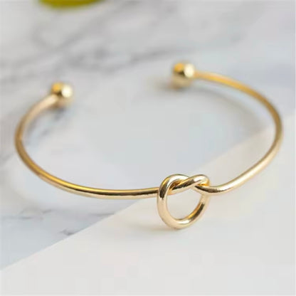 knoop armband goud